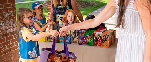 Girl Scouts selling cookies